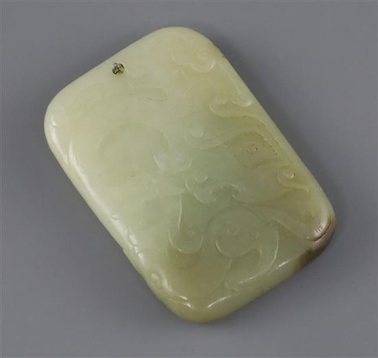 A Chinese pale celadon and brown jade plaque, 19th century, L.6.5cm